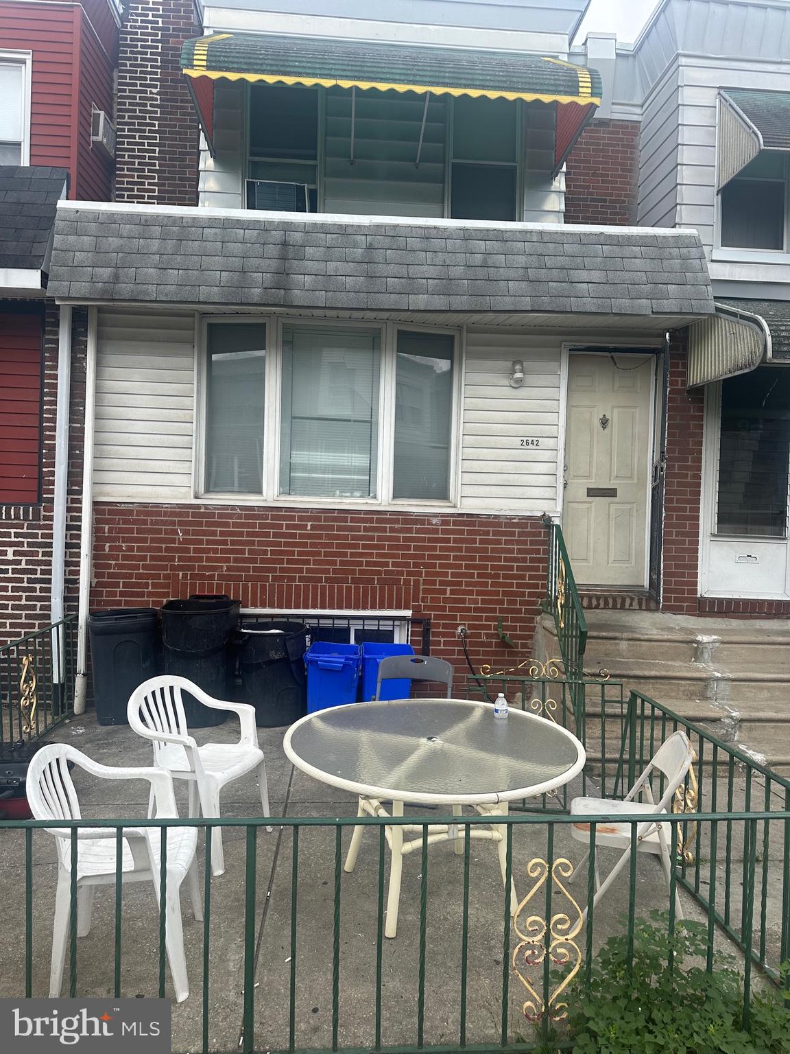 a view of table and chairs in patio