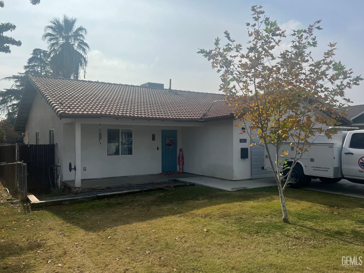 a view of a house with swimming pool and sitting area