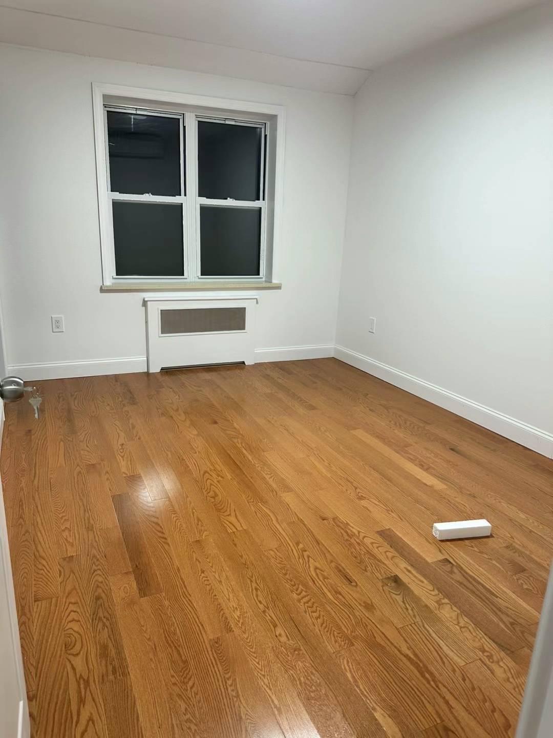 a view of an empty room with a kitchen