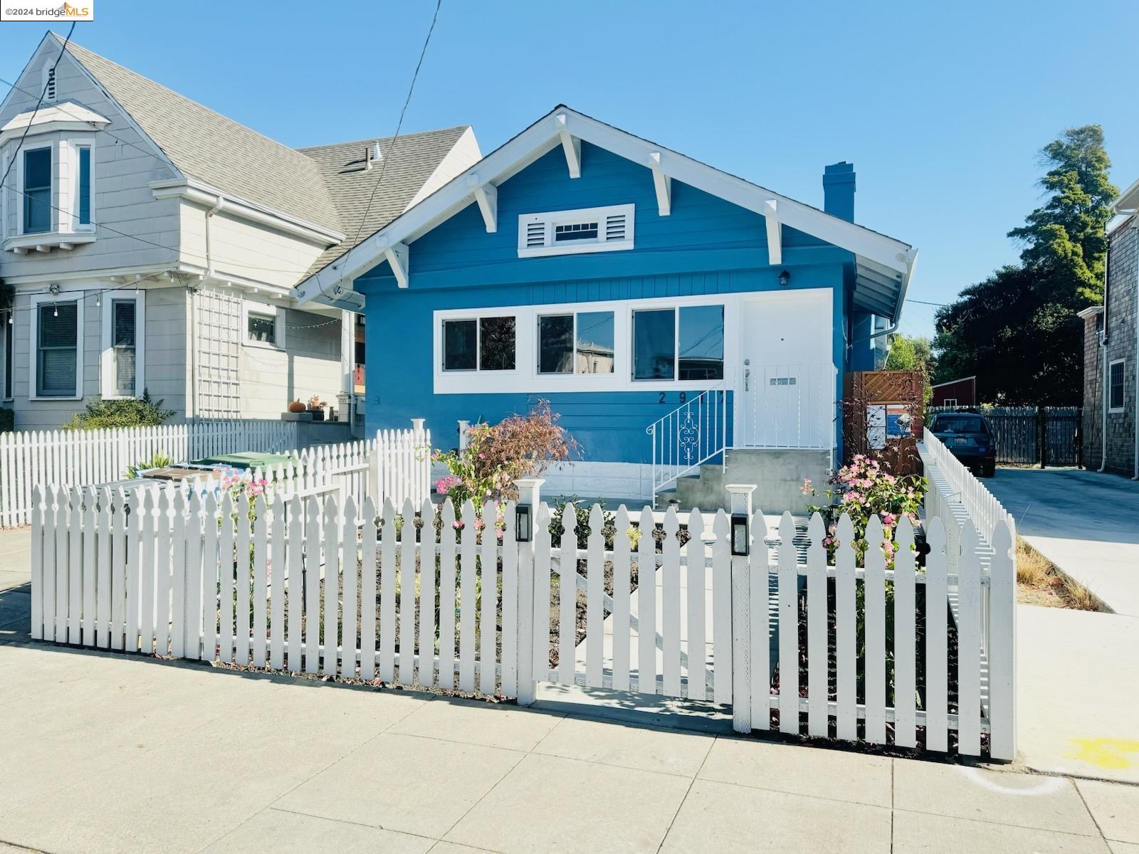 a front view of a house with a fence