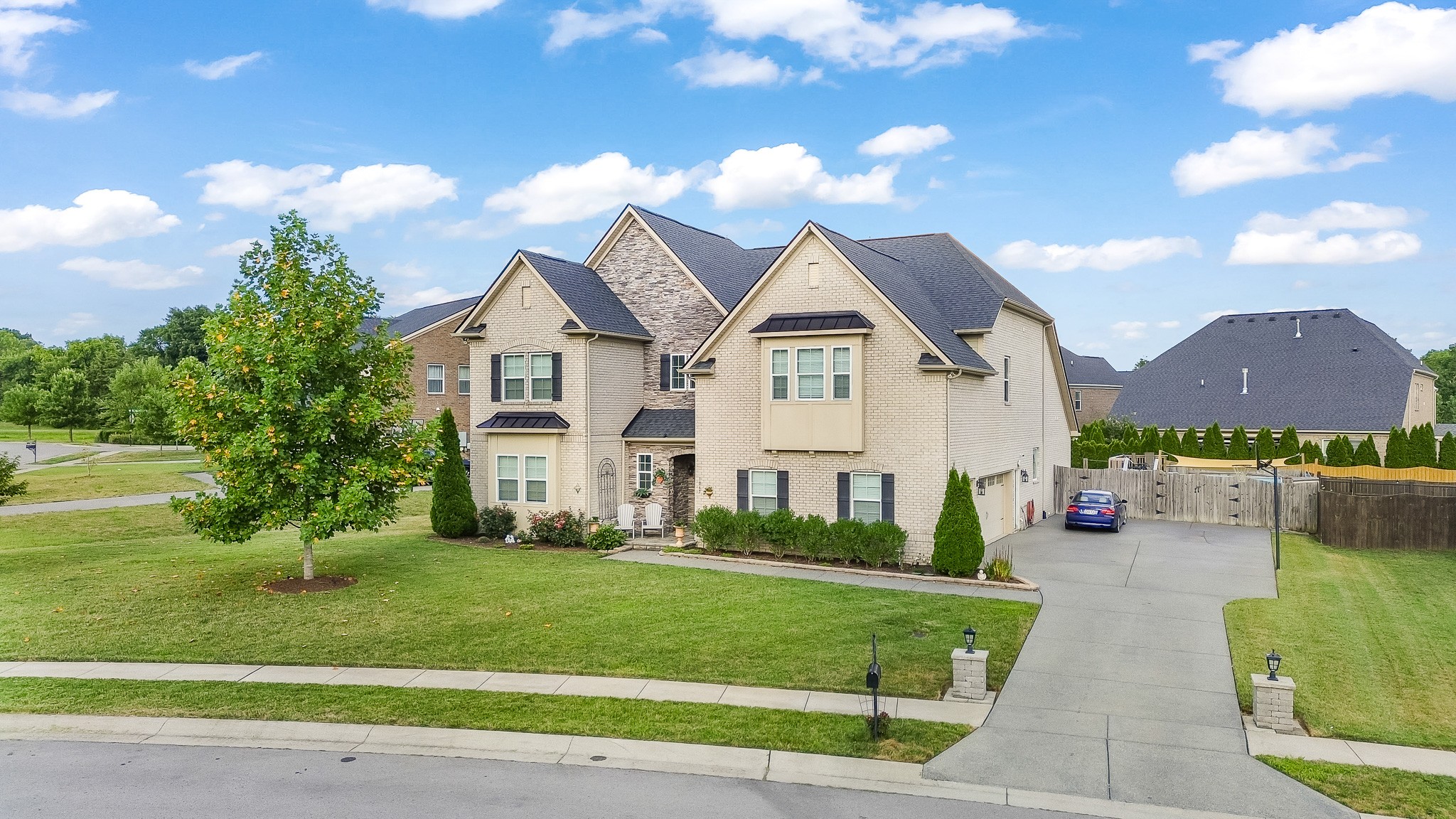 a front view of a house with a yard