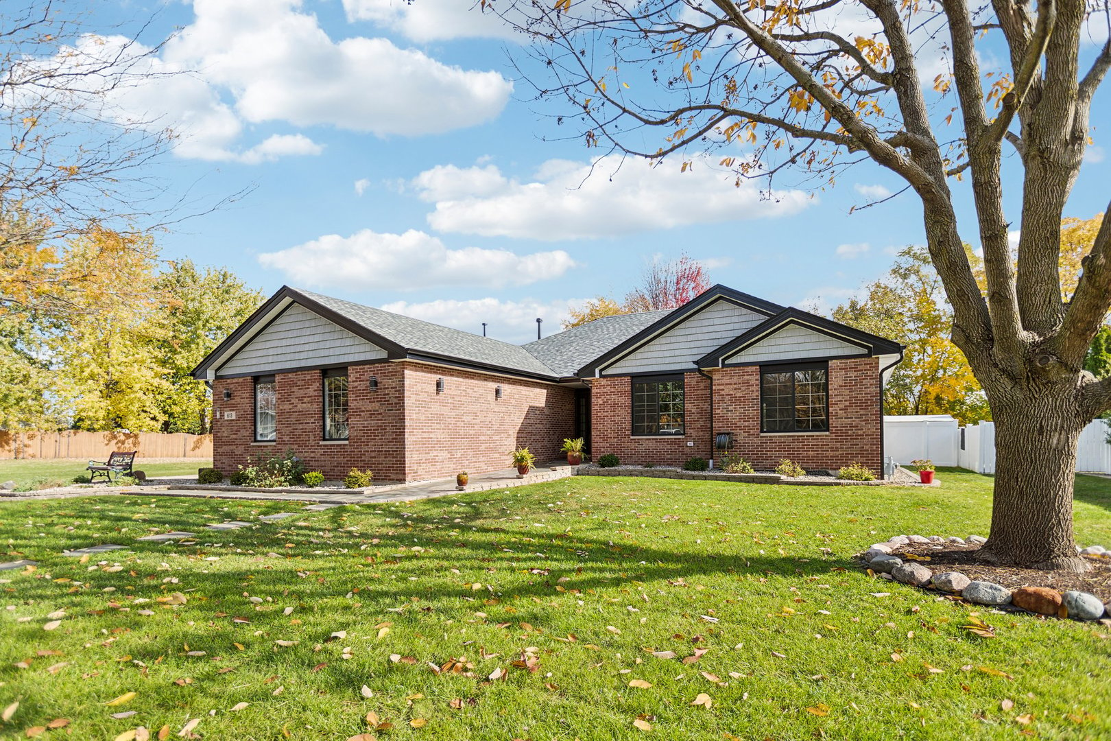 a front view of a house with a yard