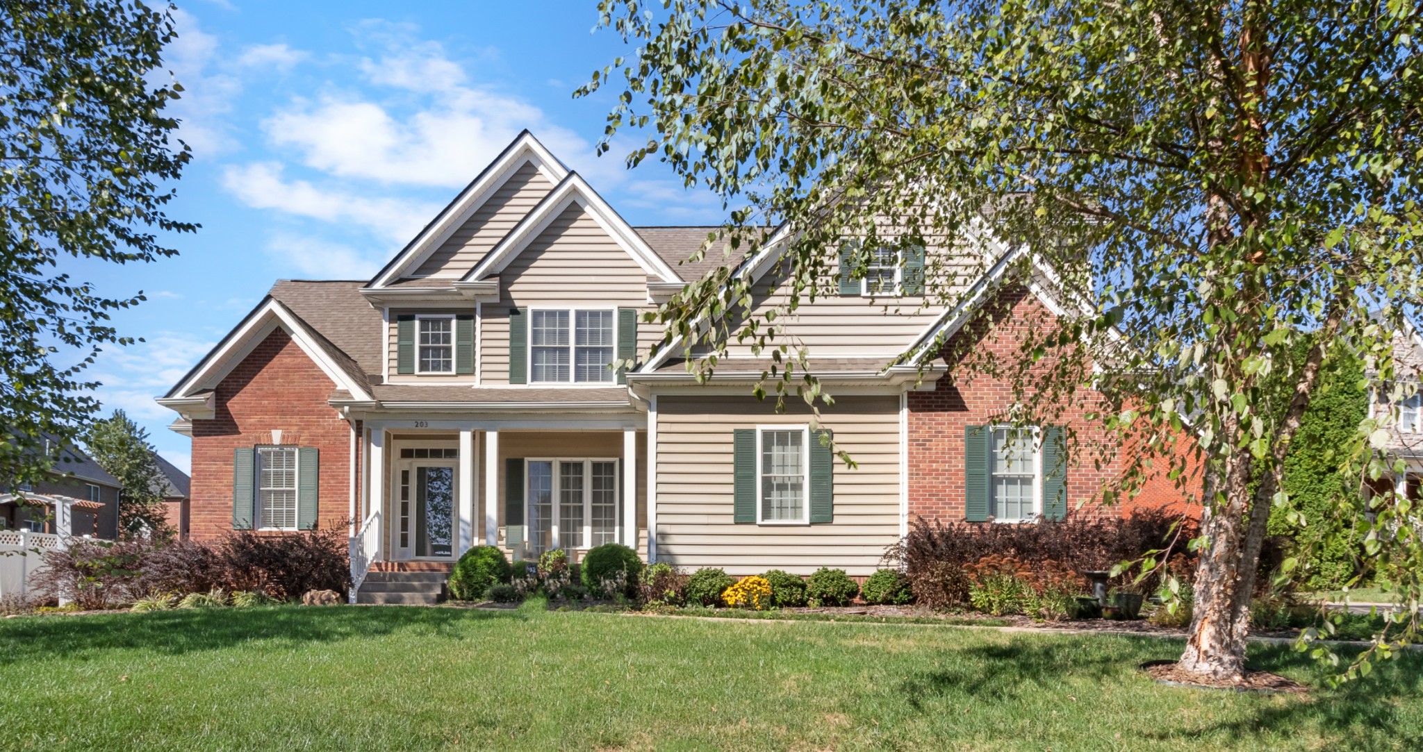 front view of a house with a yard