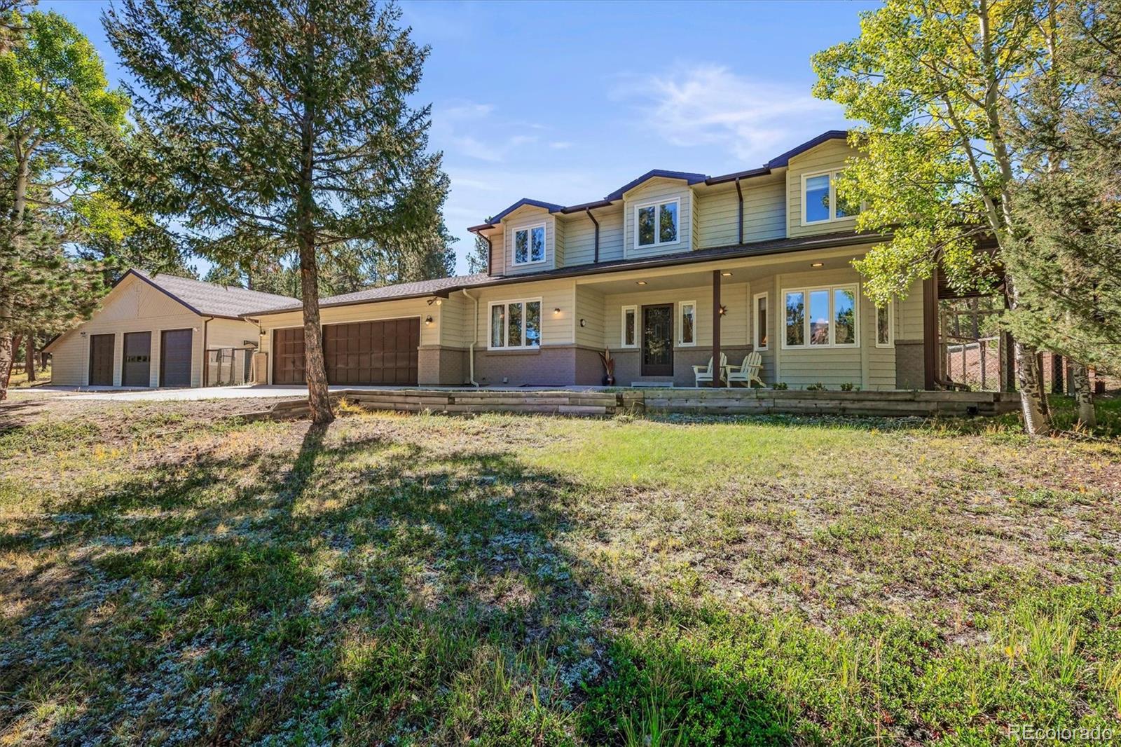 front view of a house with a yard