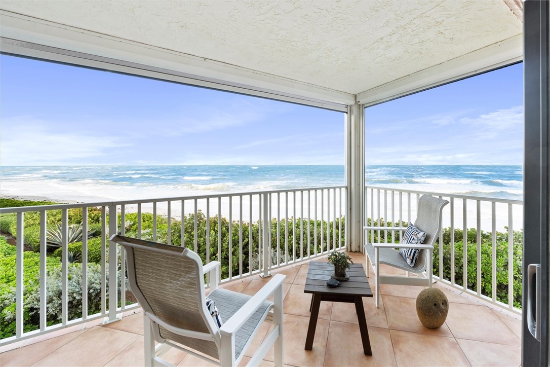 a view of a balcony with chairs