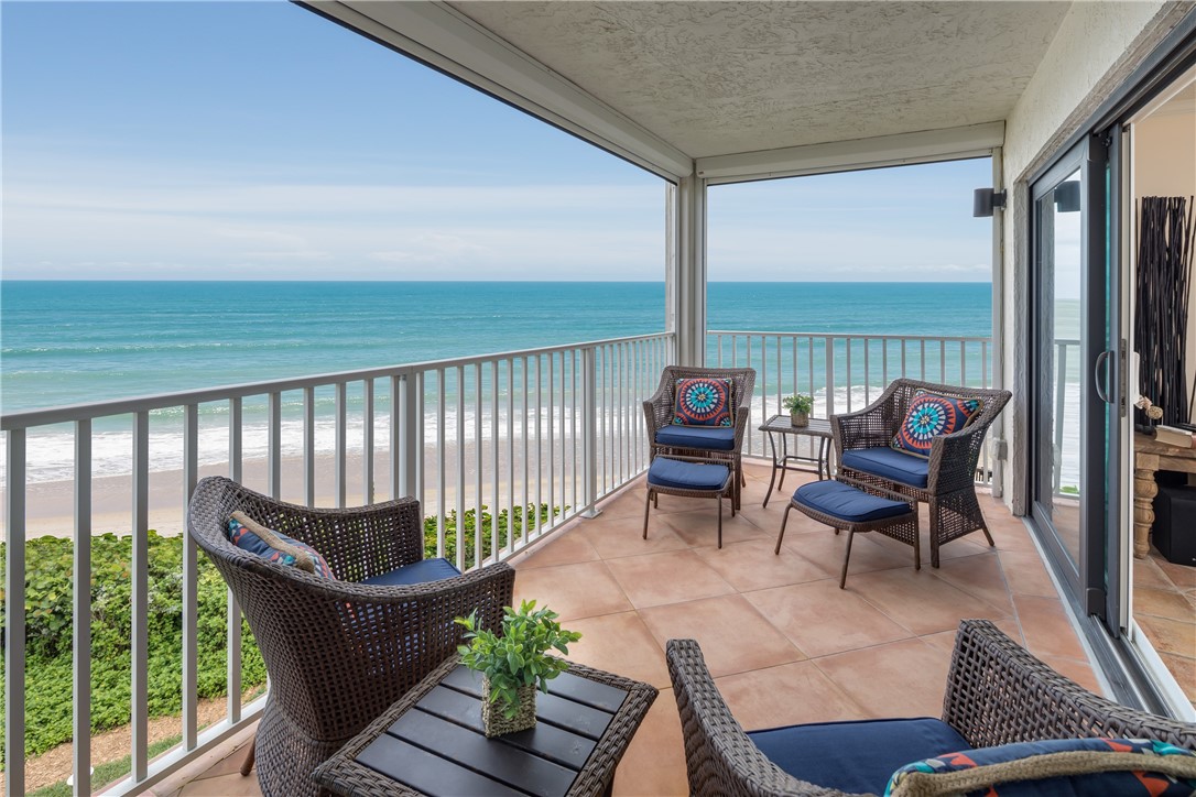 a balcony with chairs