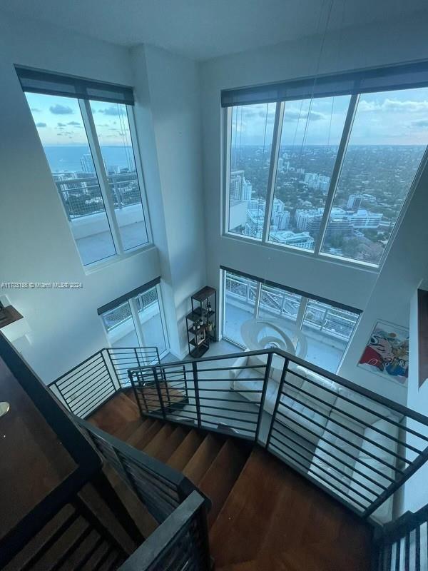 a view of room with window and wooden floor