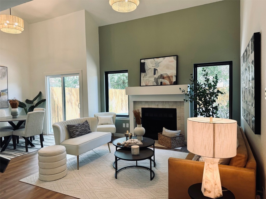 a living room with furniture a rug and a fireplace