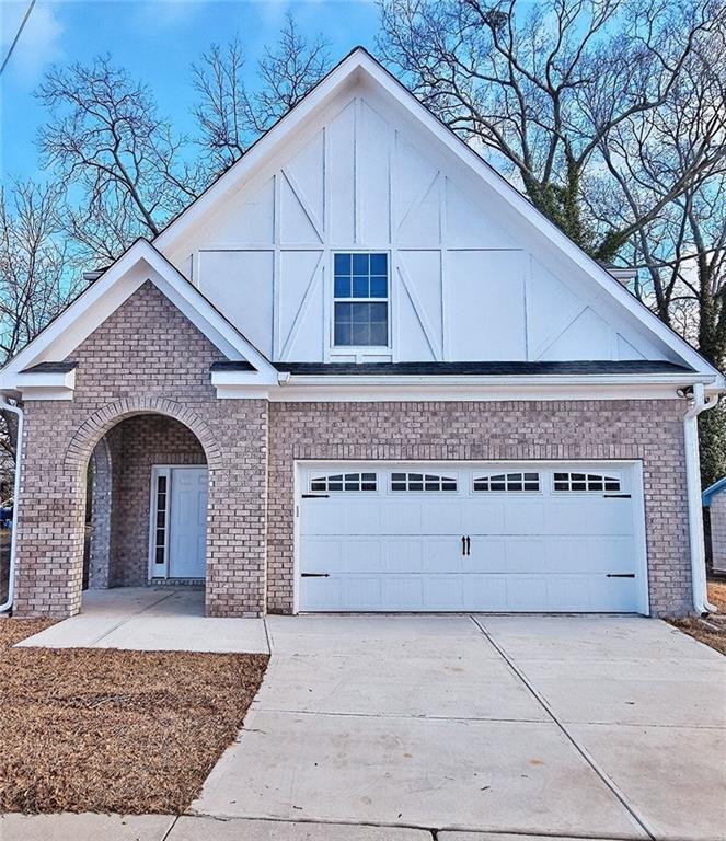 a front view of a house with garage