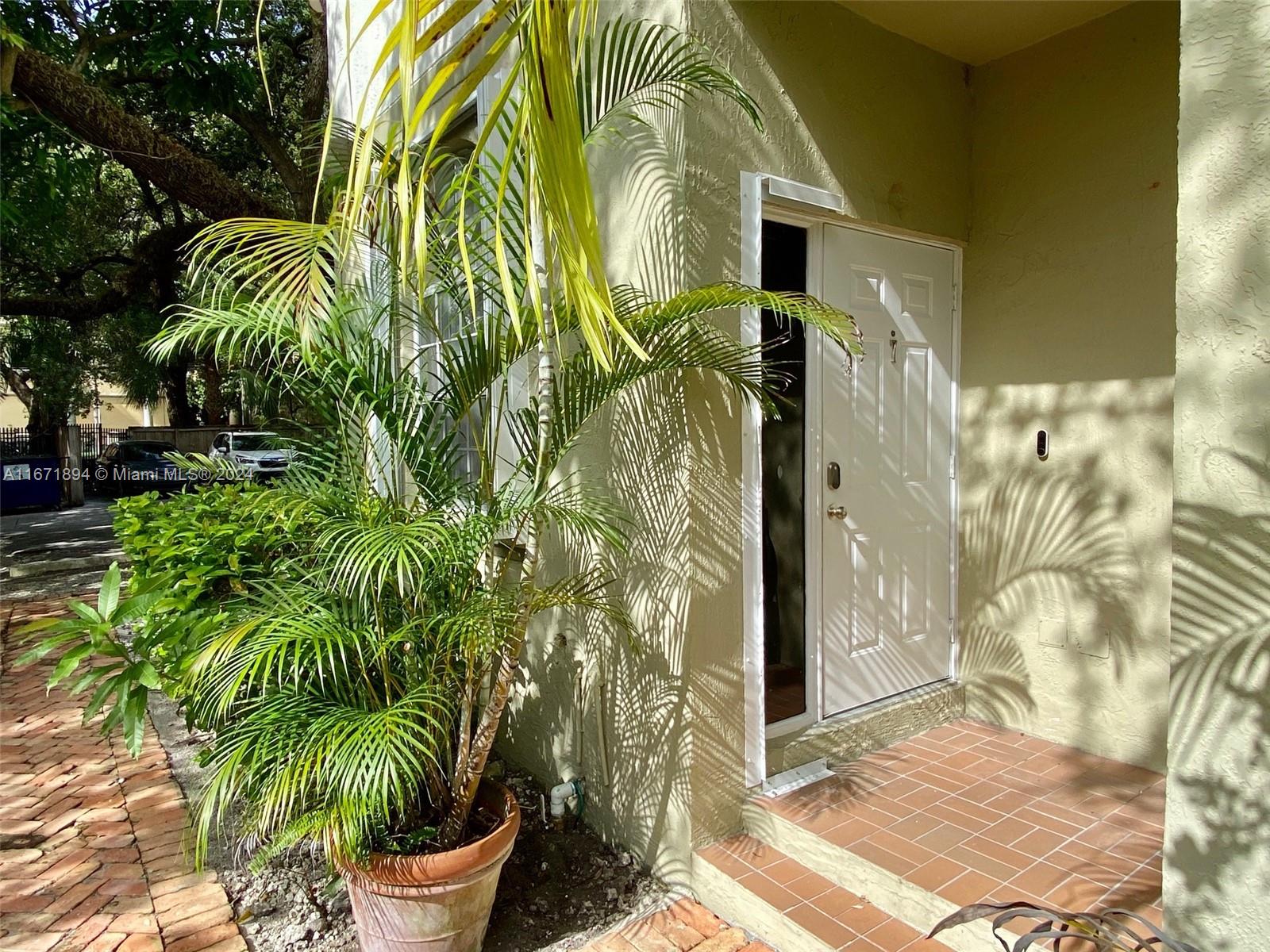 a view of a potted plants in front of a house