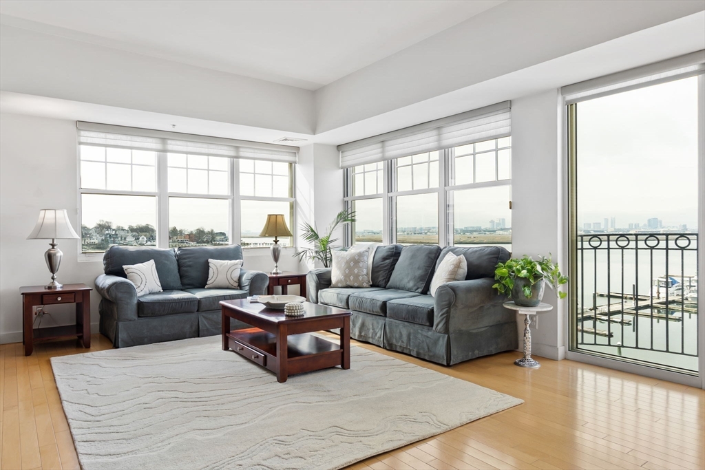 a living room with furniture and windows