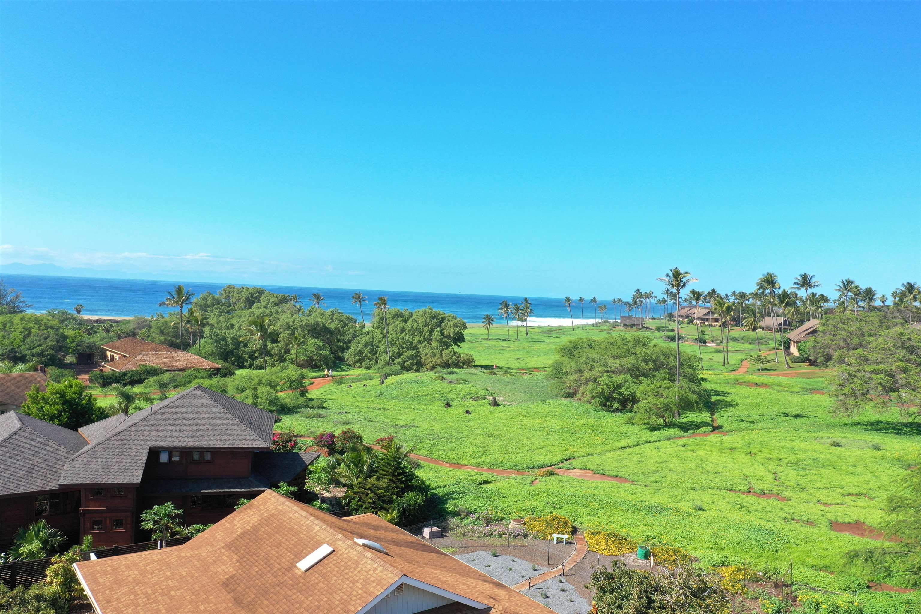 an aerial view of a house with yard