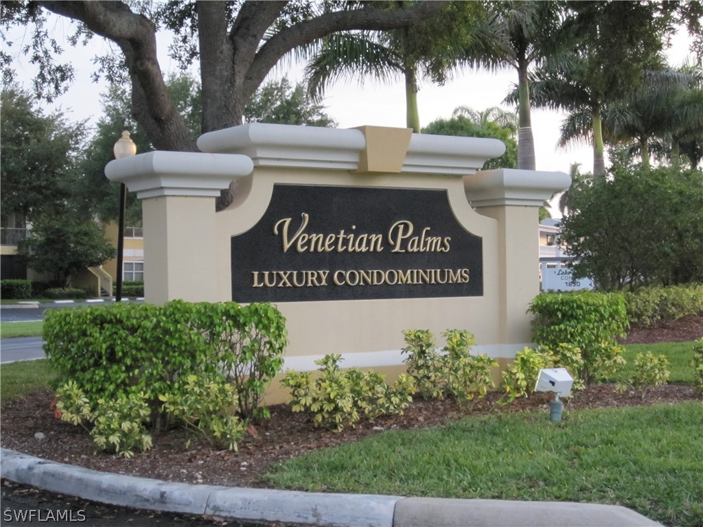 a view of outdoor space with signage and flags