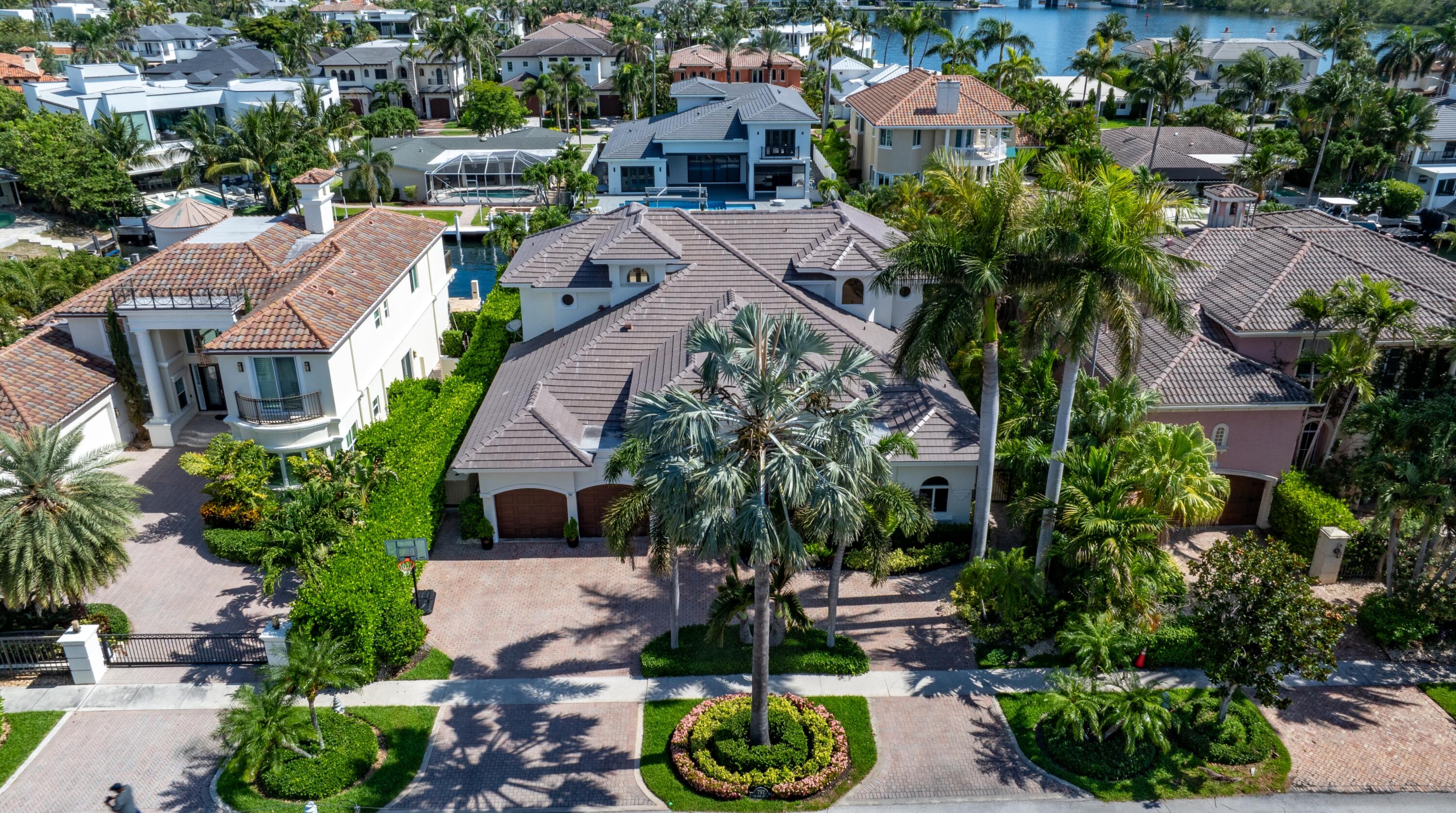 an aerial view of multiple houses with yard