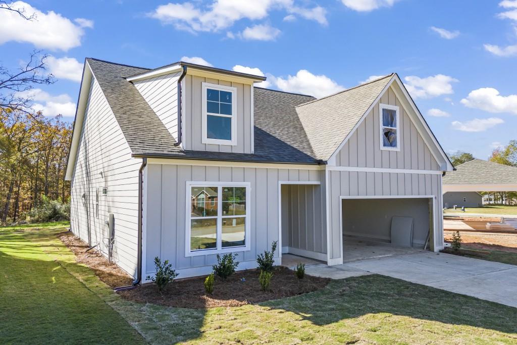 a front view of a house with a yard