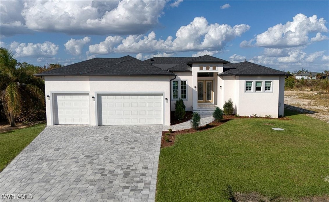 a front view of a house with garden