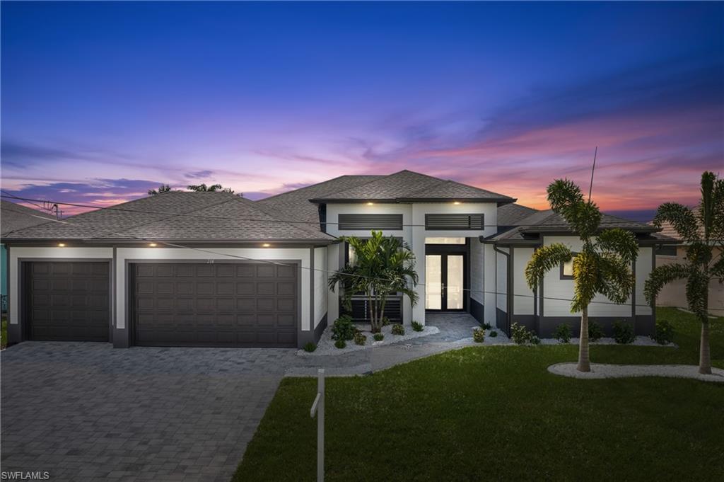 a front view of a house with a yard