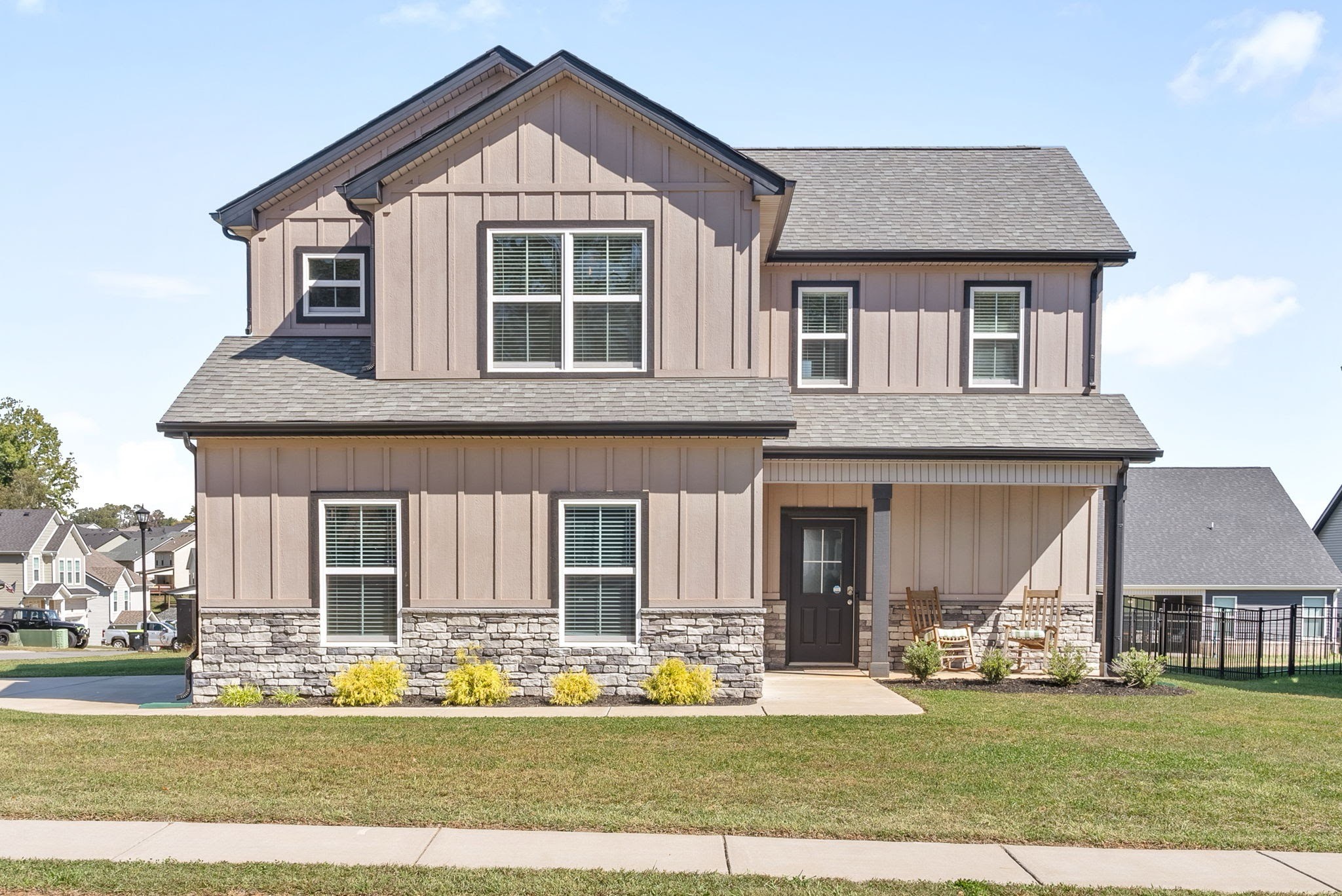 a front view of a house with a yard