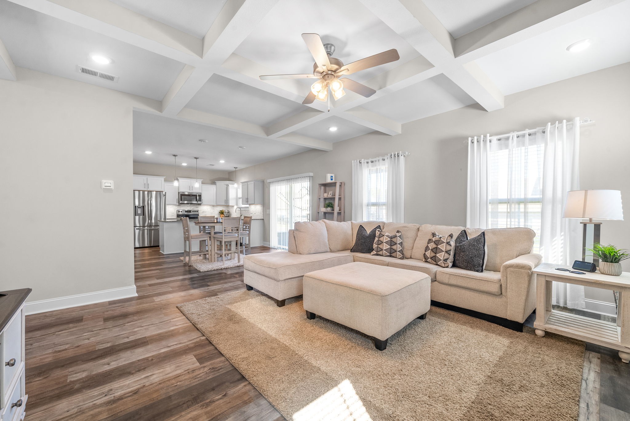 a living room with furniture and a large mirror