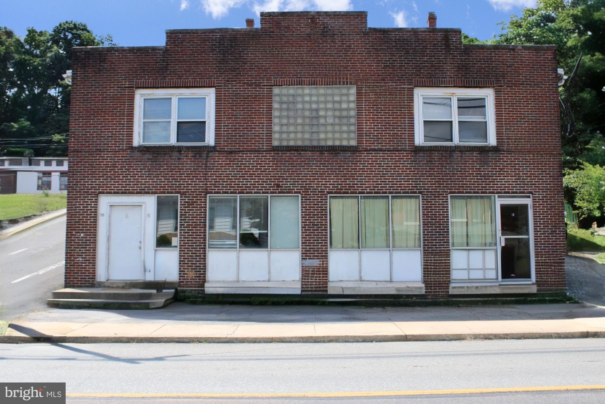 a front view of a house with a garage