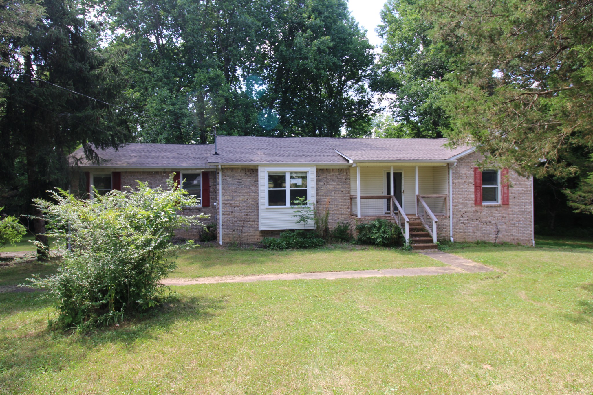 a view of a house with a backyard