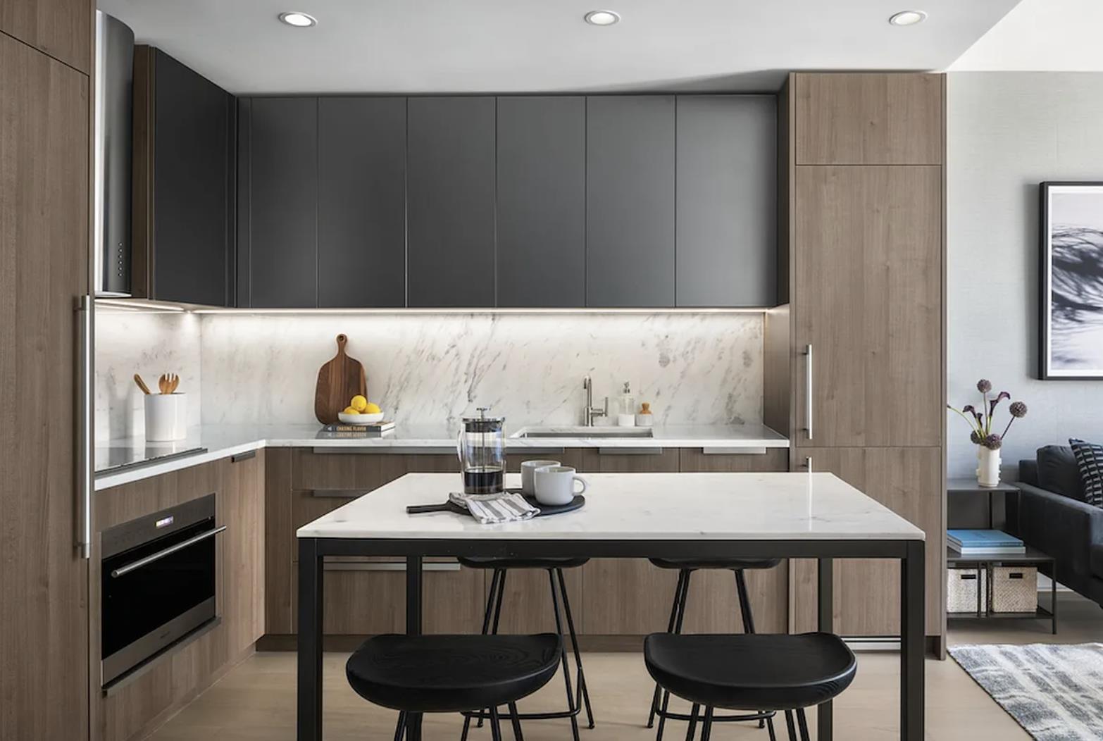 a kitchen with a table and chairs in it