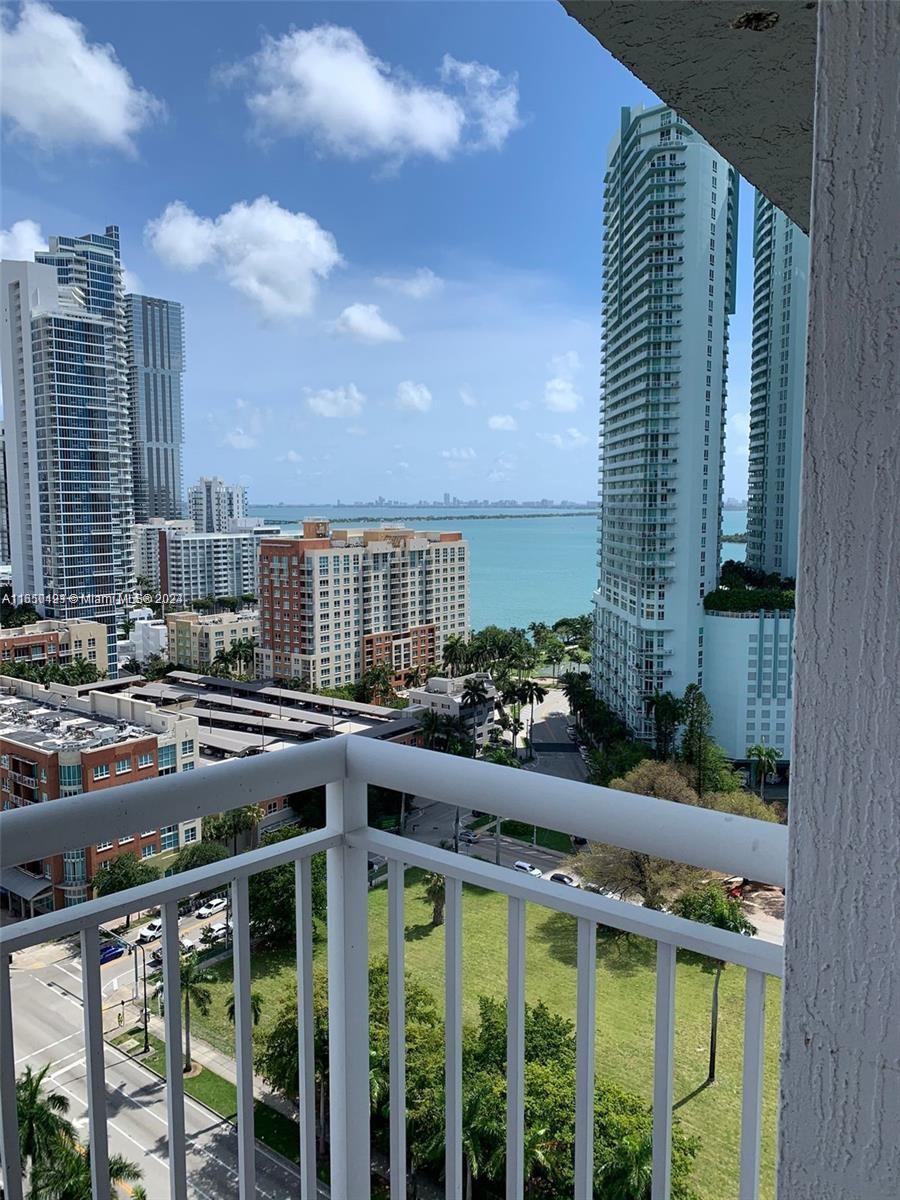 a view of balcony with outdoor seating and city view