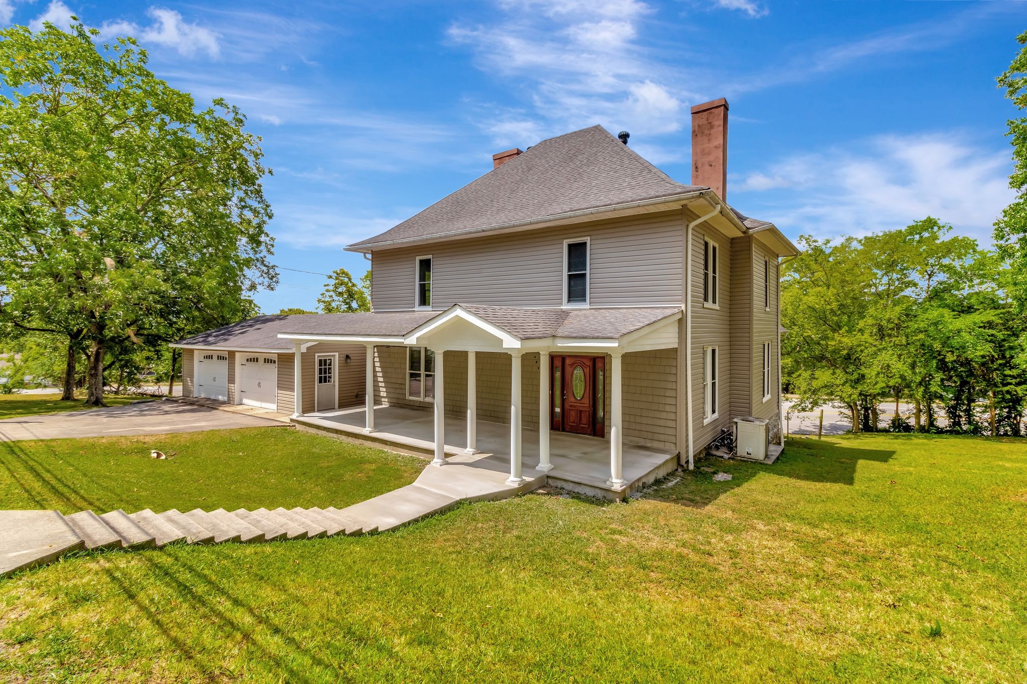 a front view of a house with a yard