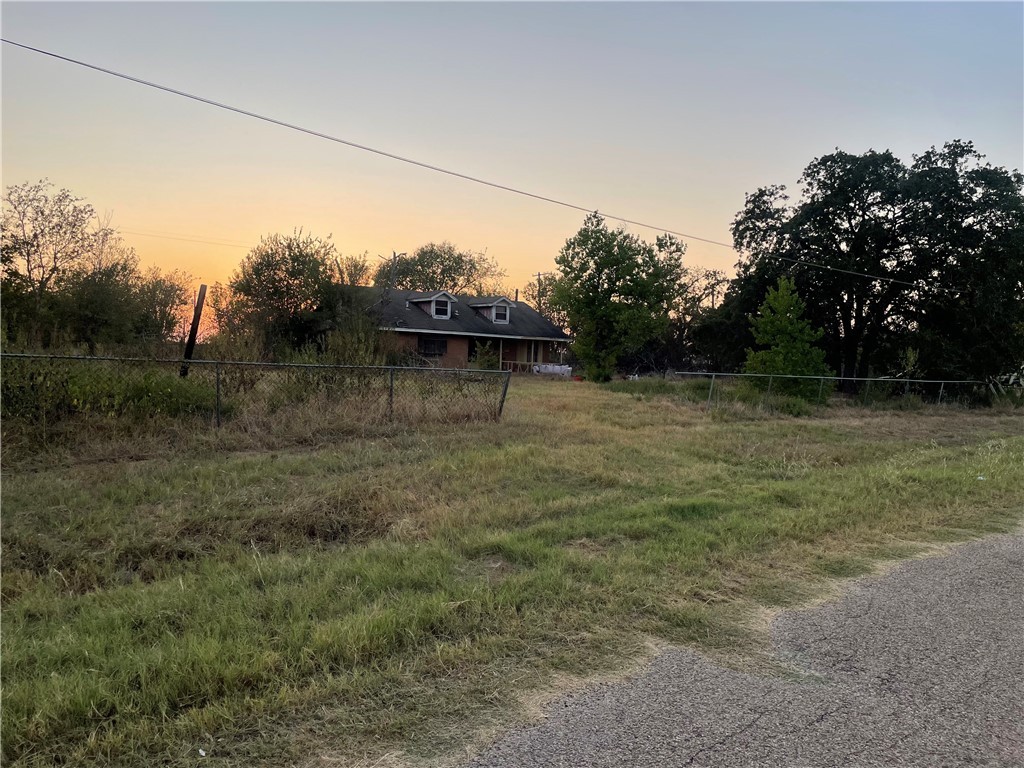 View of yard at dusk