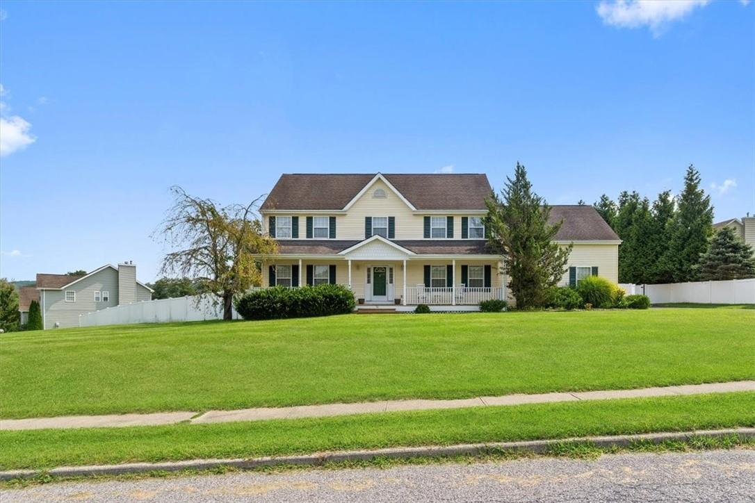 a front view of a house with a yard