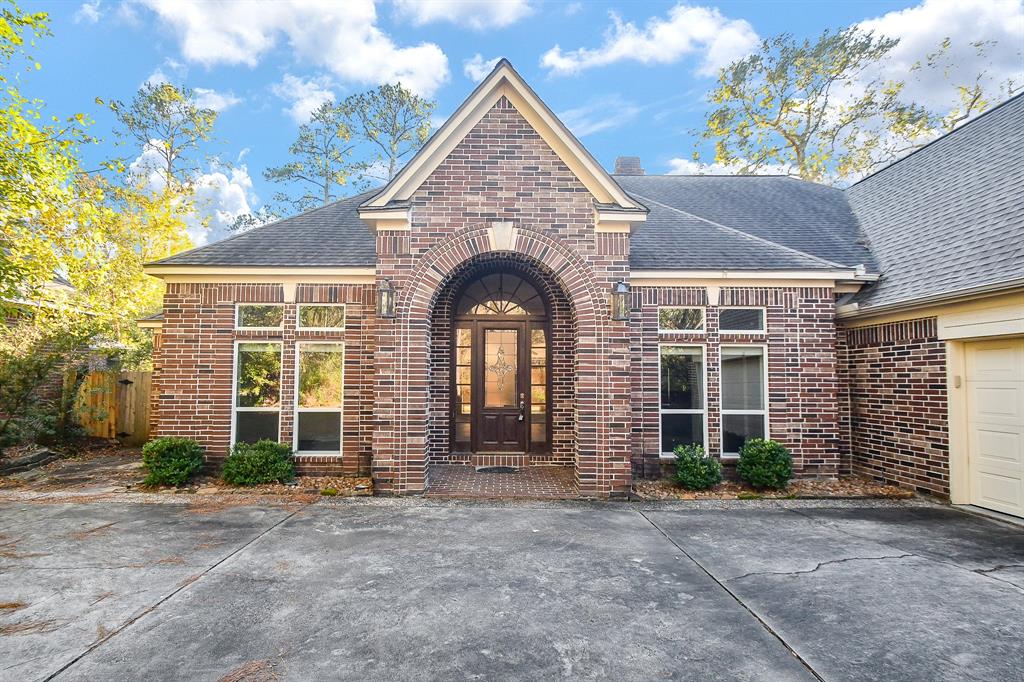 a view of a brick house with a large windows