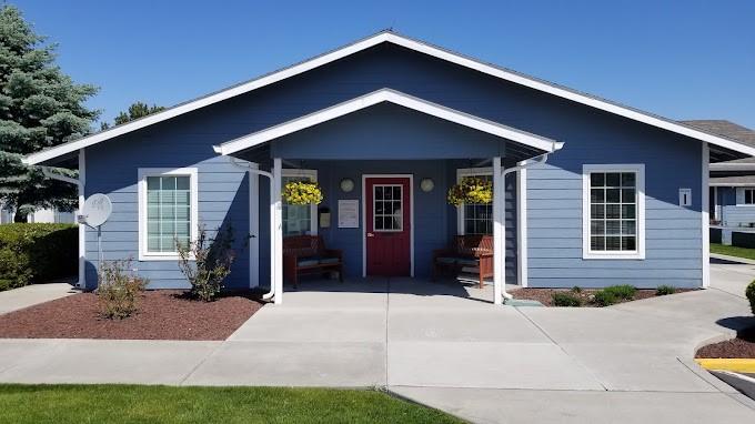 a front view of a house with yard