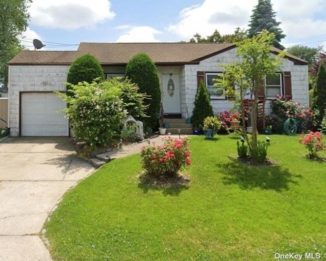 a front view of a house with a yard and outdoor seating