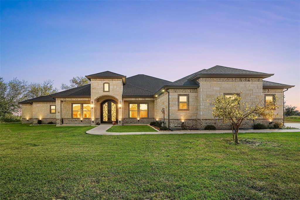 a front view of a house with a yard