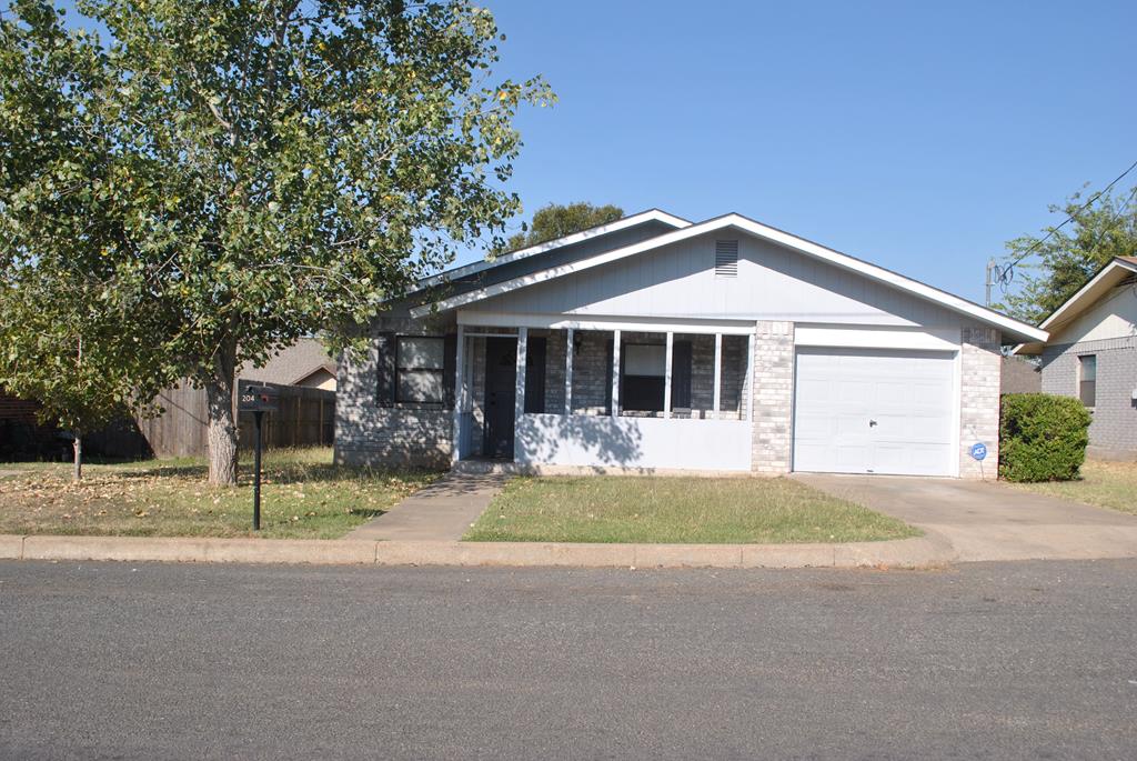 a front view of a house with a garden and porch