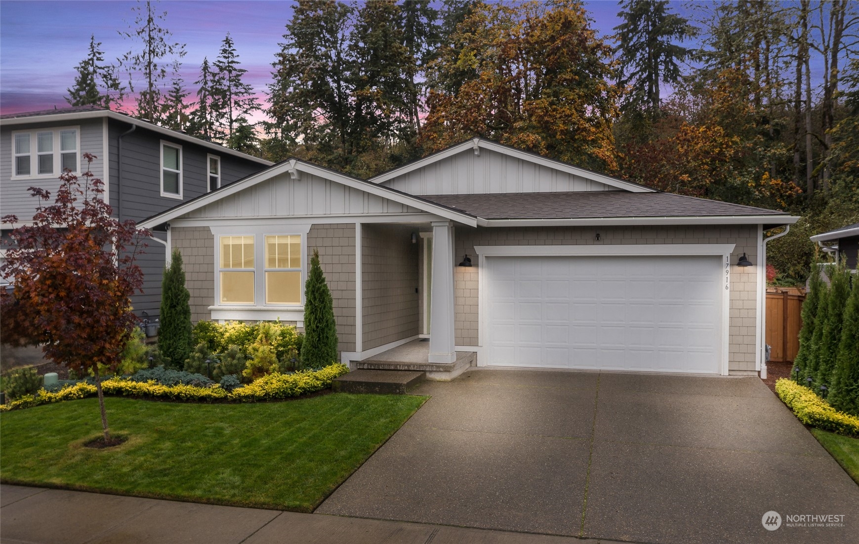 a front view of house with yard and green space