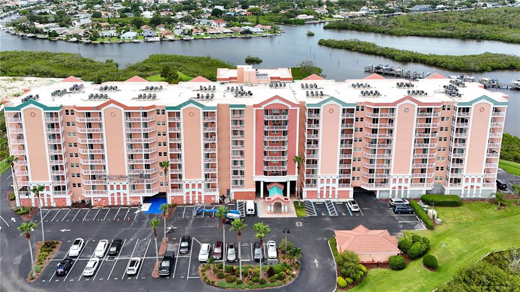 a large building with swimming pool and outdoor seating