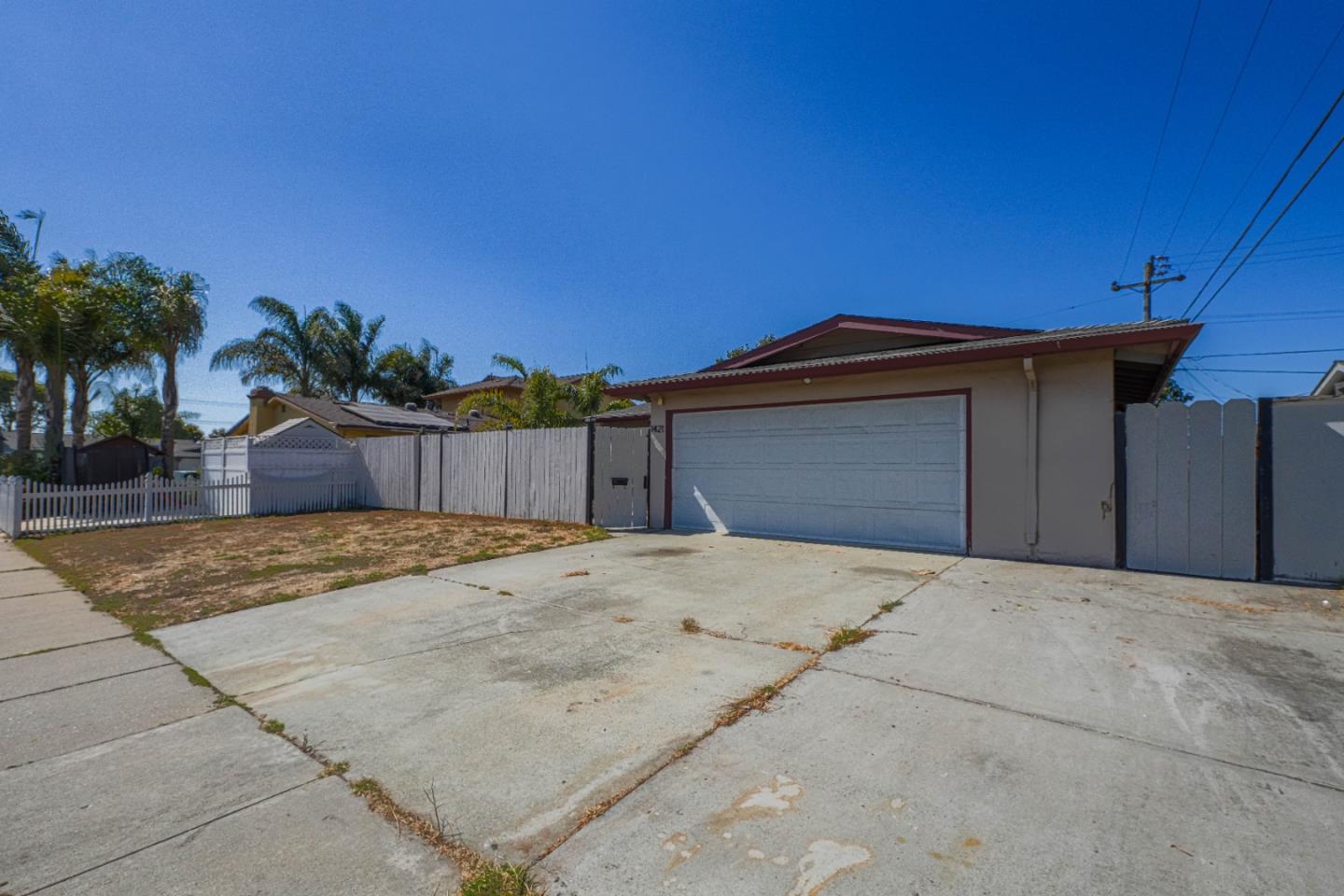 a view of garage with a patio