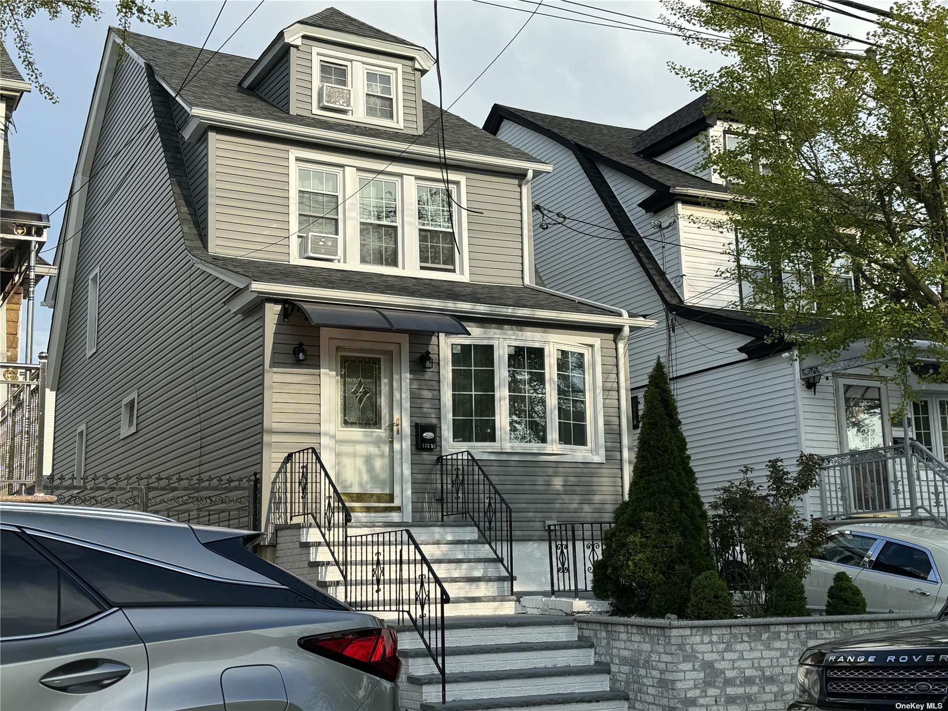 a front view of a house with parking