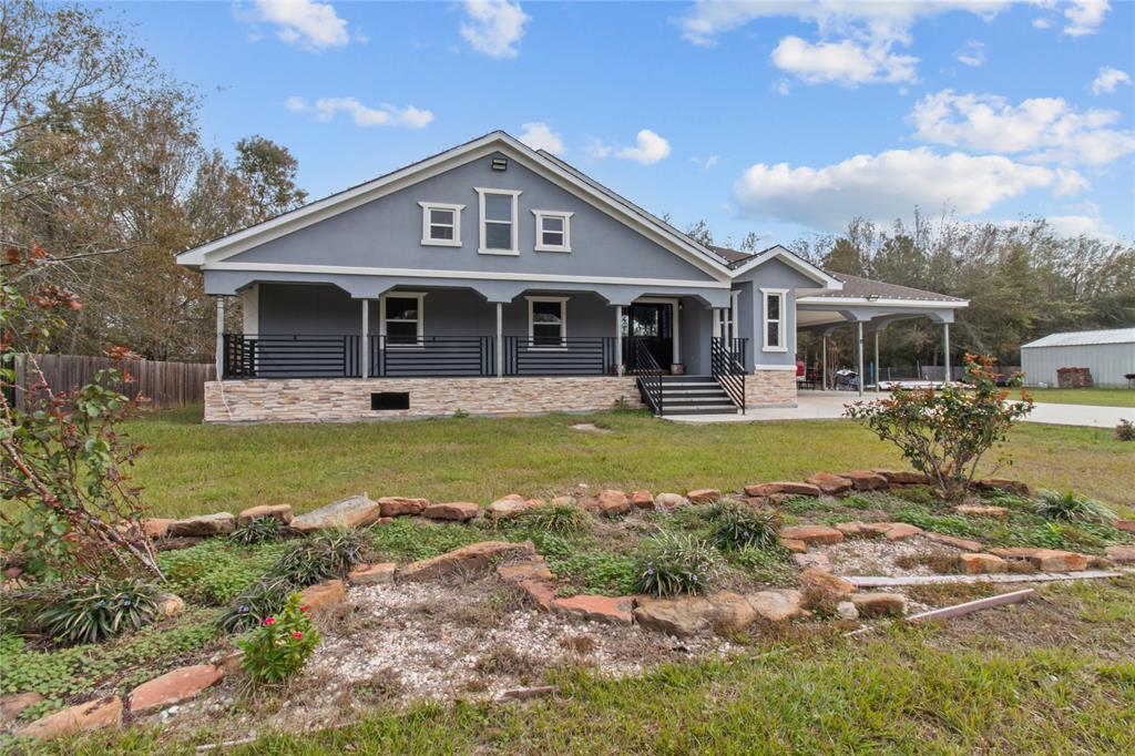 a front view of a house with swimming pool and porch