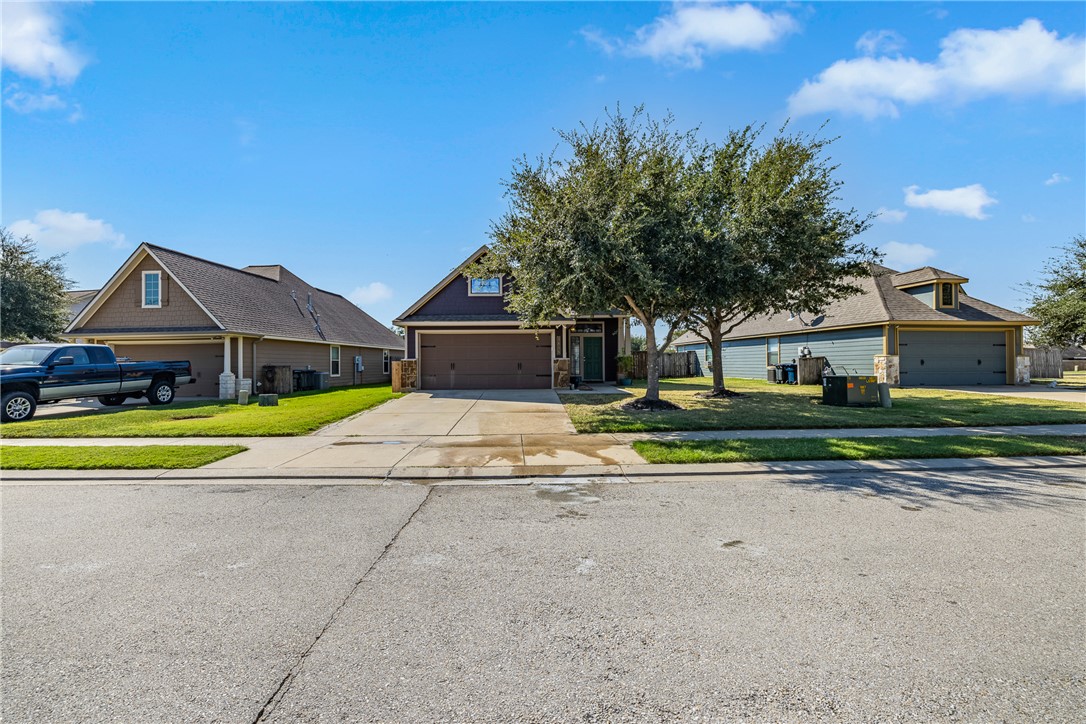 View of front of property with a garage and a fron