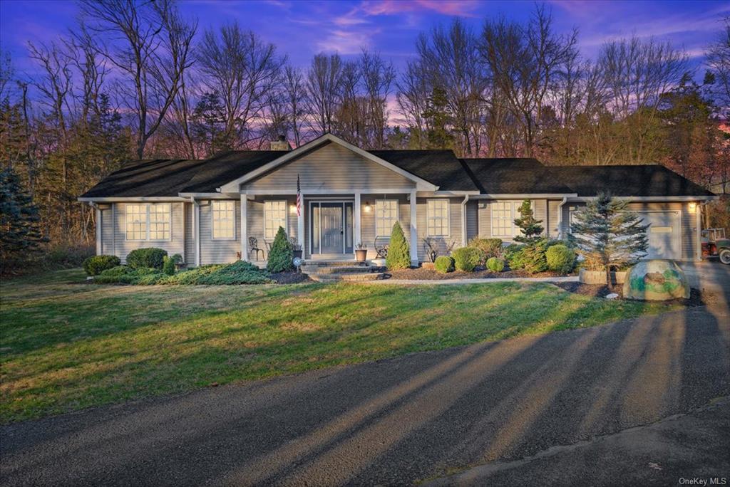 Ranch-style house with a lawn