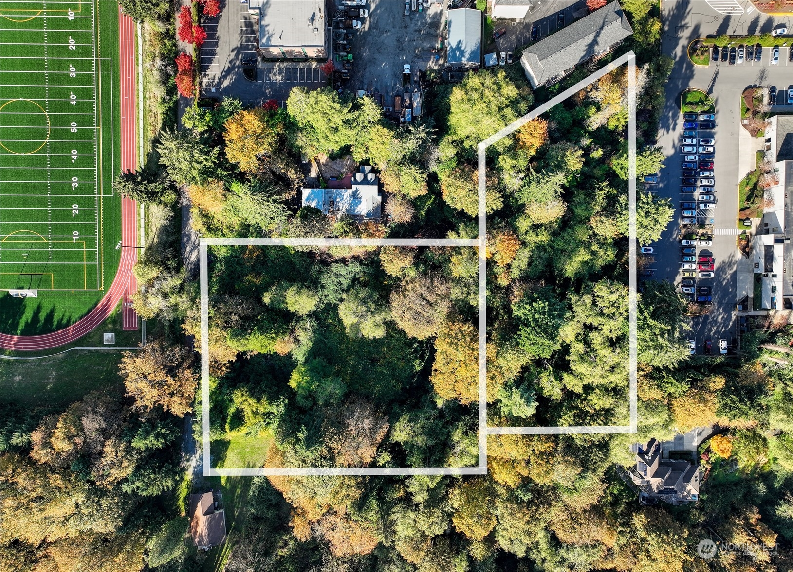 an aerial view of residential houses with outdoor space