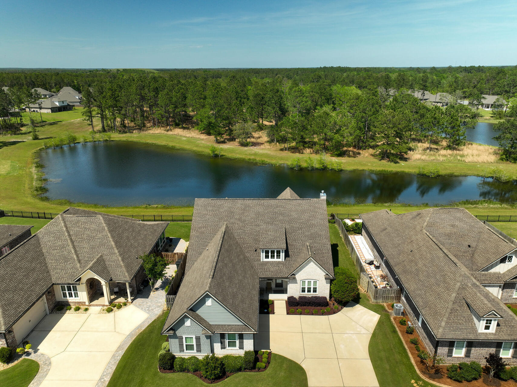 an aerial view of a house with a lake view