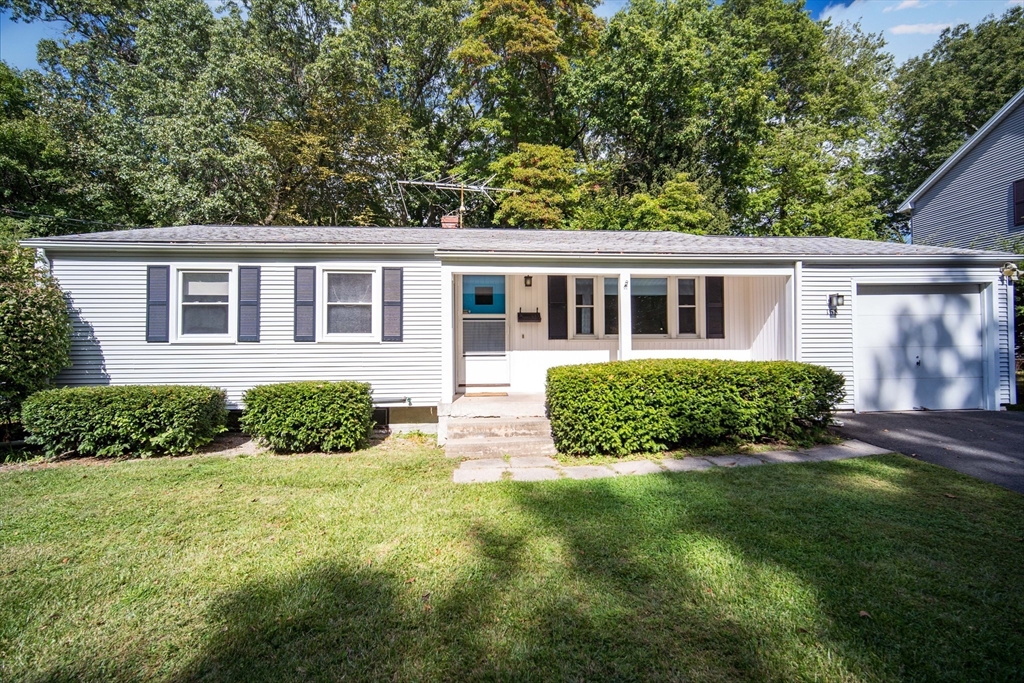 front view of a house with a yard