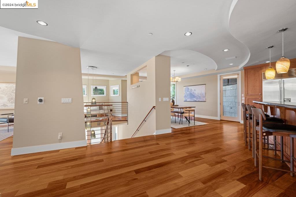 a view of a kitchen with dining space and wooden floor