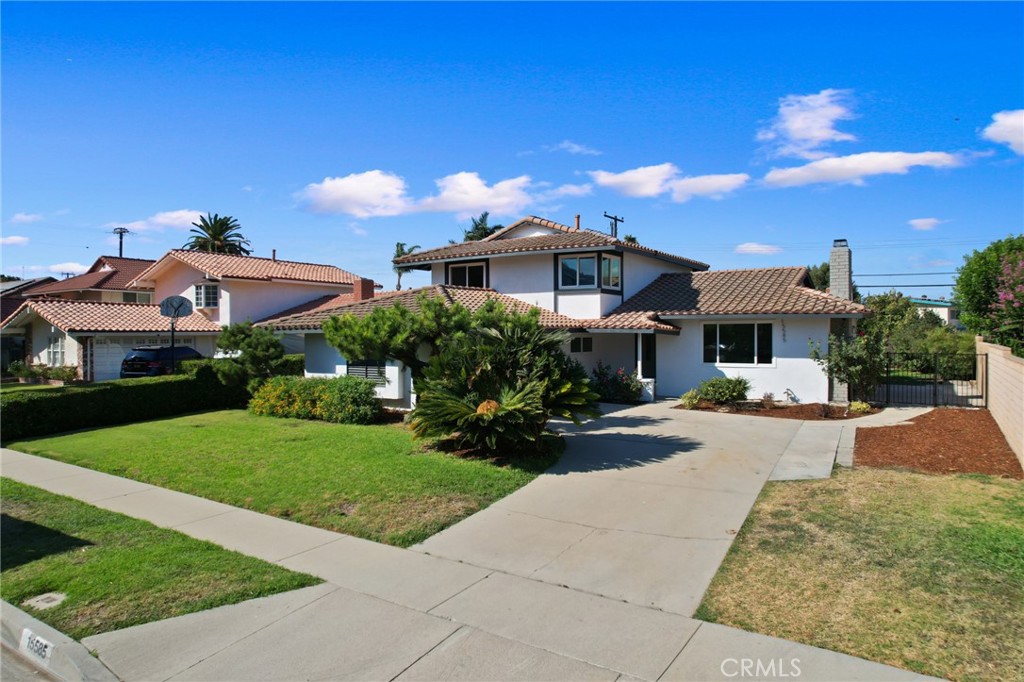 a front view of a house with a yard and a garage