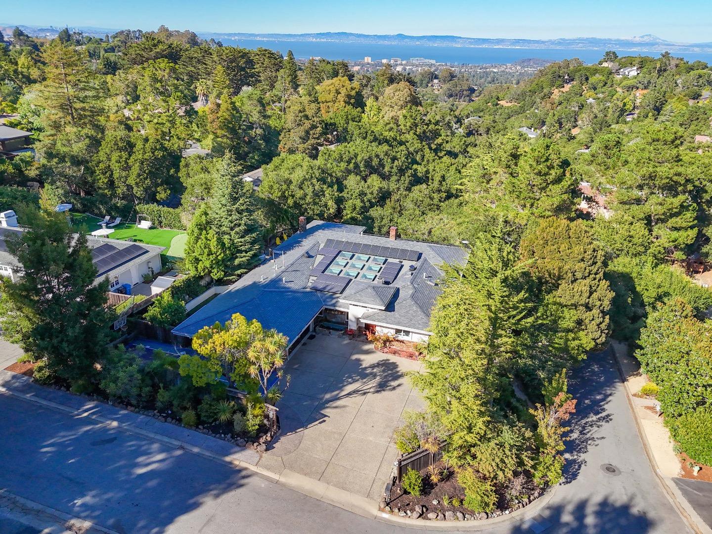 an aerial view of a house with a yard basket ball court