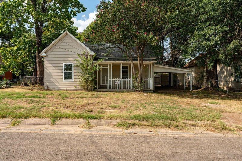 a front view of house with garage