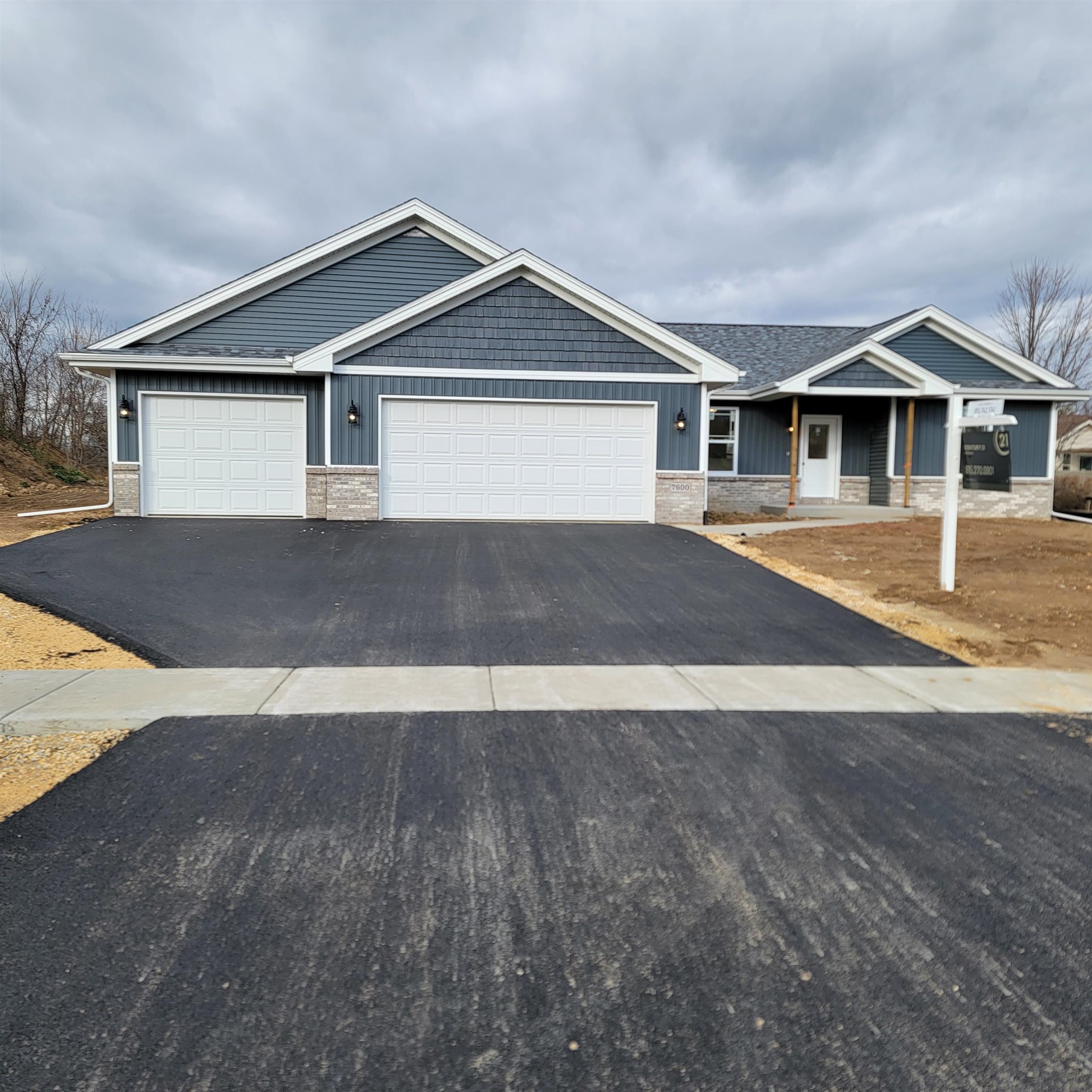 a front view of a house with yard